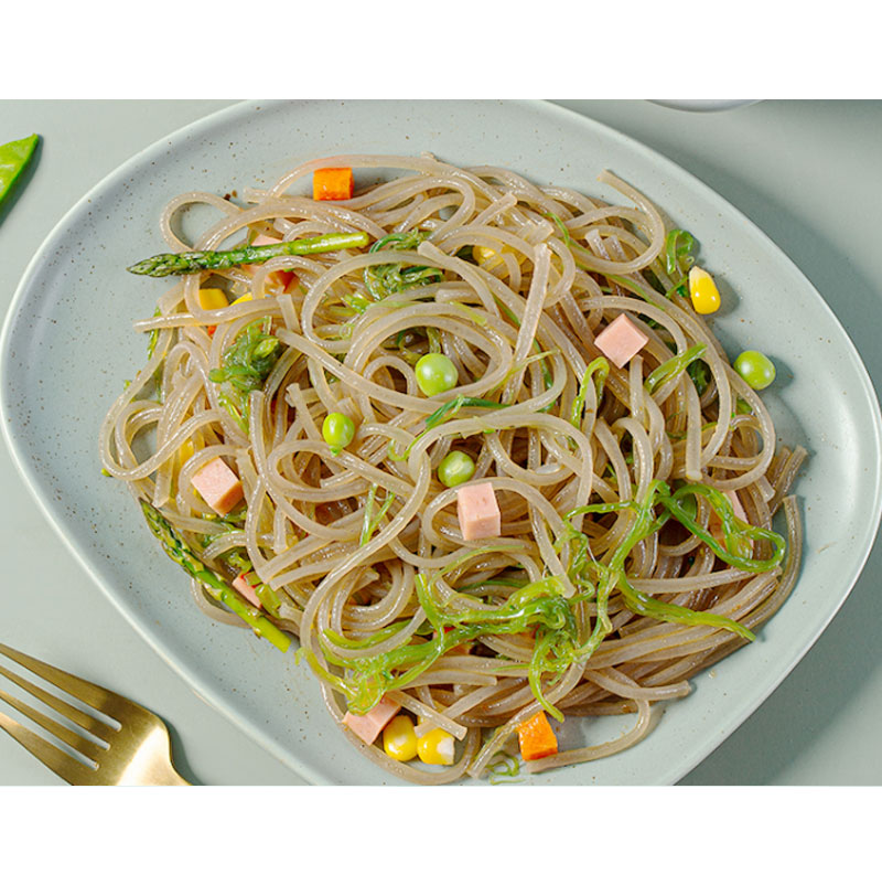 A visually appealing plate of low-carb pasta featuring konjac noodles, a diabetic-friendly option, garnished with vibrant vegetables and a flavorful sauce.